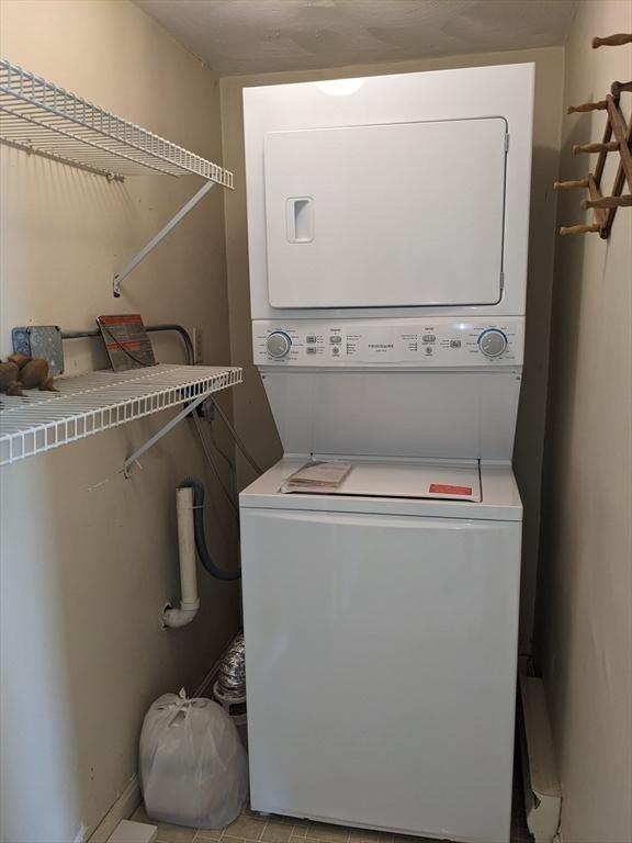 179 N End Blvd Unit A, Salisbury, MA 01952 - laundry area with stacked washer and clothes dryer