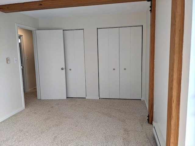 179 N End Blvd Unit A, Salisbury, MA 01952 - unfurnished bedroom featuring two closets, carpet, and baseboards