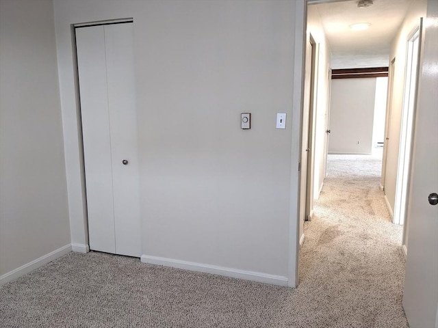 179 N End Blvd Unit A, Salisbury, MA 01952 - hallway featuring light colored carpet and baseboards