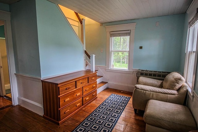 301 Main St, Dennis, MA 02639 - living area featuring hardwood / wood-style flooring, stairway, and a wainscoted wall