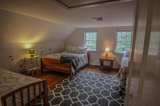 301 Main St, Dennis, MA 02639 - bedroom featuring hardwood / wood-style flooring, vaulted ceiling, and baseboards