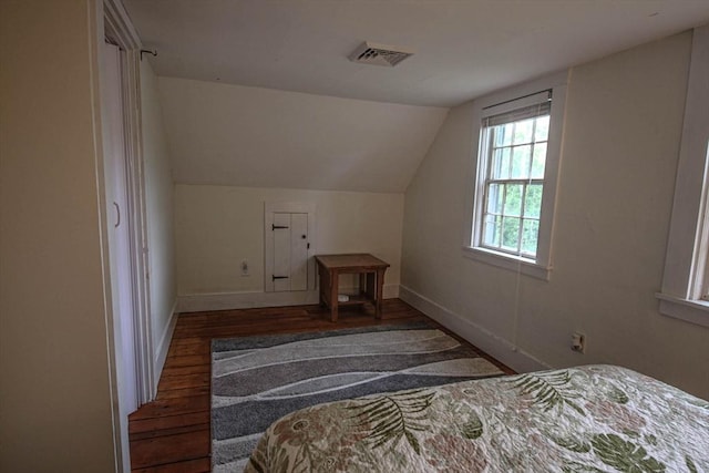 301 Main St, Dennis, MA 02639 - bedroom featuring lofted ceiling, wood finished floors, and baseboards
