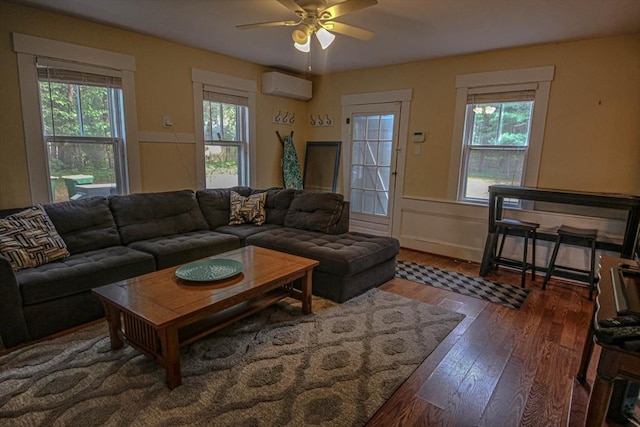 301 Main St, Dennis, MA 02639 - living room with a wall unit AC, plenty of natural light, a ceiling fan, hardwood / wood-style flooring, and wainscoting