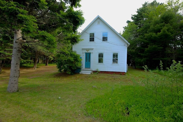 301 Main St, Dennis, MA 02639 - view of front of property featuring entry steps and a front lawn