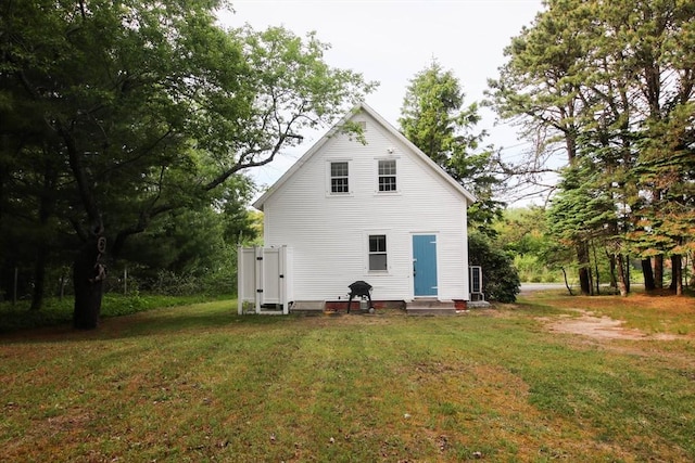301 Main St, Dennis, MA 02639 - rear view of property with entry steps and a lawn
