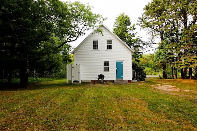 301 Main St, Dennis, MA 02639 - back of house with entry steps and a lawn