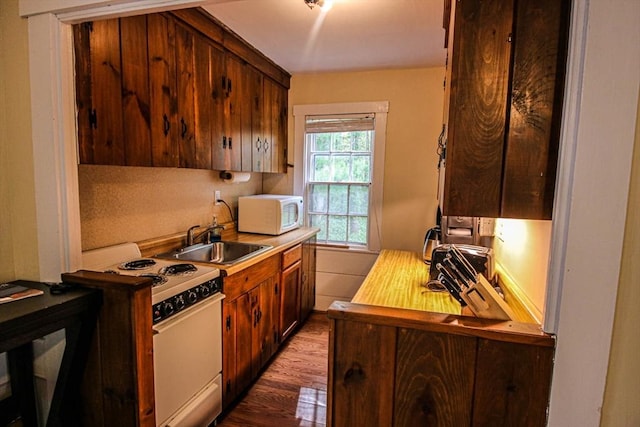 301 Main St, Dennis, MA 02639 - kitchen with white appliances, a sink, dark wood-style flooring, and light countertops