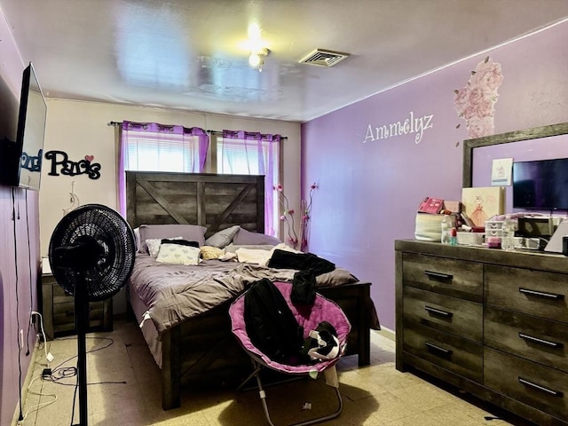 bedroom with visible vents and light floors