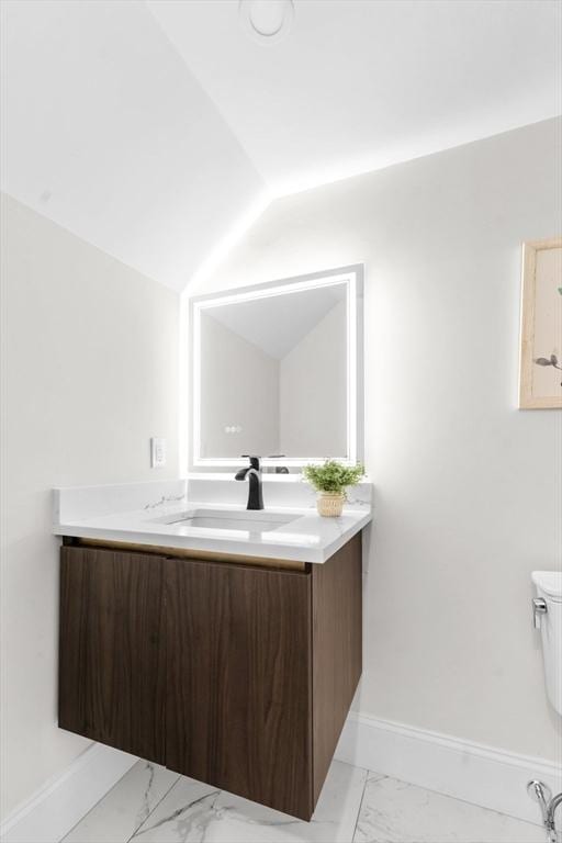 bathroom with toilet and vanity