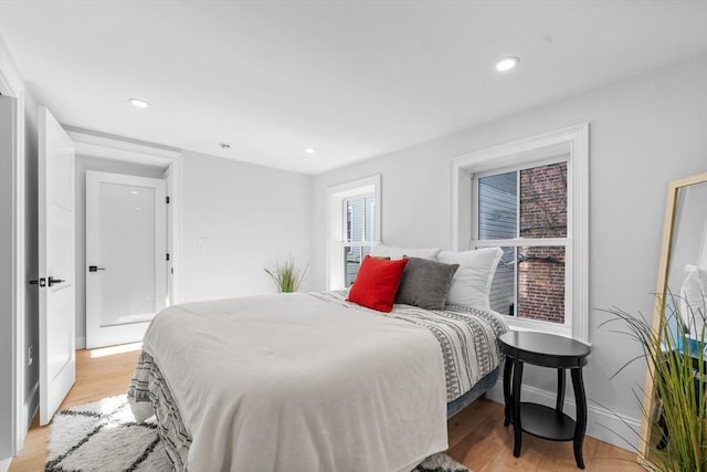 bedroom with light hardwood / wood-style floors