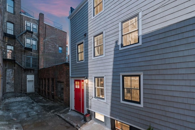 view of back house at dusk