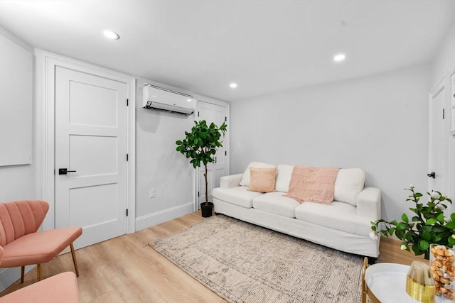 living room with light wood-type flooring and a wall mounted AC