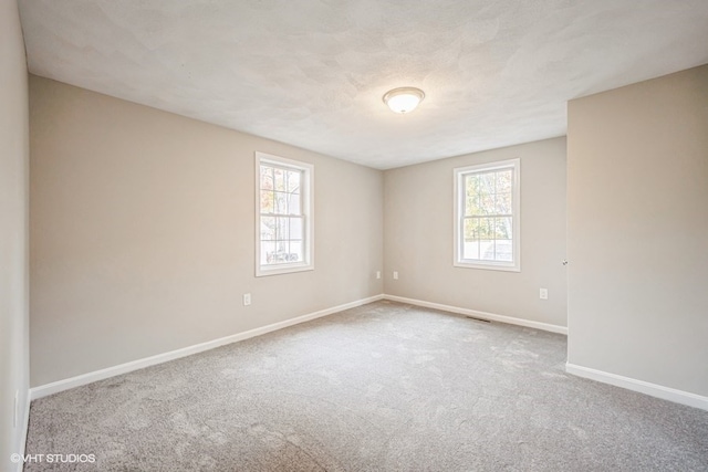 unfurnished room featuring carpet floors