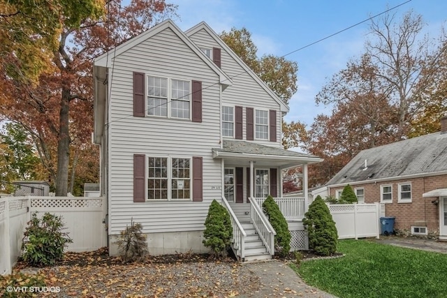 view of front facade with a porch and a front yard