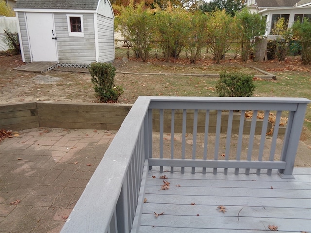 wooden terrace with a shed