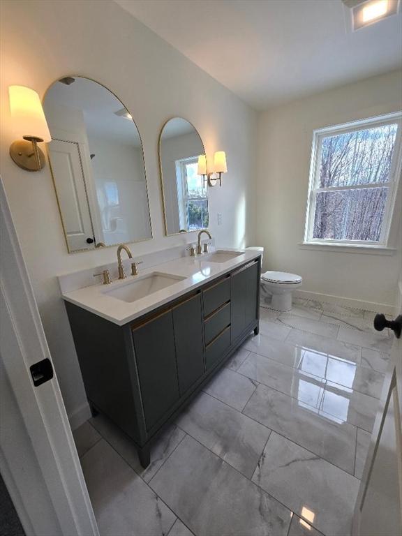 bathroom with vanity and toilet