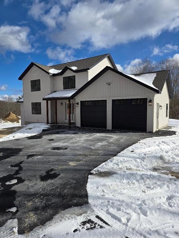 modern farmhouse with a garage