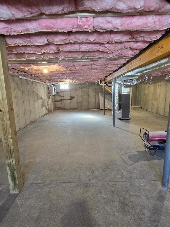 basement featuring heating unit