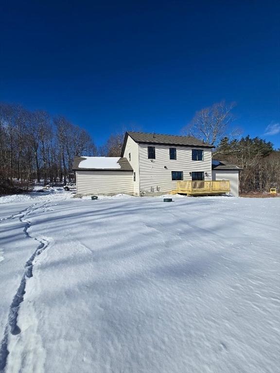 exterior space featuring a wooden deck