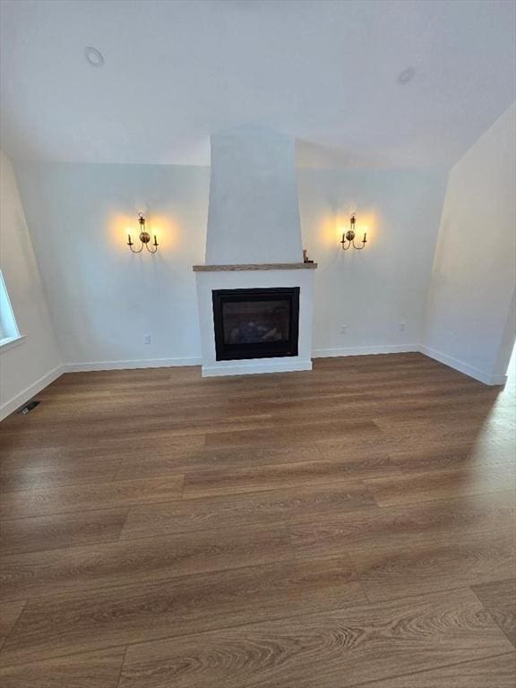 unfurnished living room with wood-type flooring