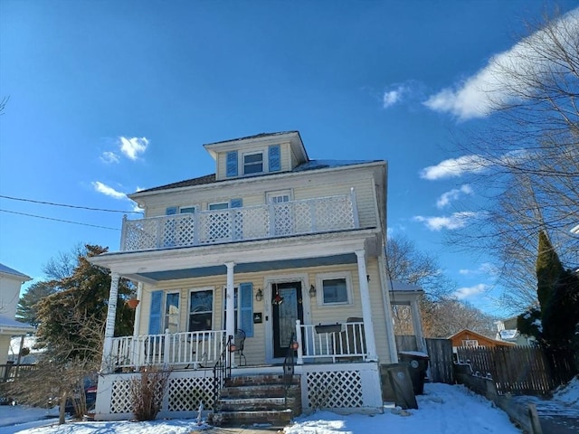 view of front of home featuring a balcony and covered porch