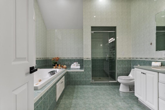 453 Forest St, North Andover, MA 01845 - bathroom with tile walls, vanity, a stall shower, a whirlpool tub, and tile patterned floors