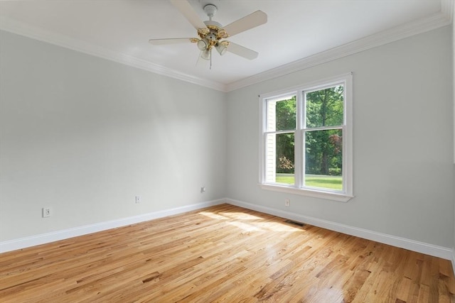 453 Forest St, North Andover, MA 01845 - spare room with light wood-style flooring, crown molding, and ceiling fan