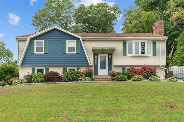 46 Lisa Ln, Methuen, MA 01844 - split foyer home with a front yard and a chimney