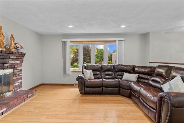 46 Lisa Ln, Methuen, MA 01844 - living area featuring light wood-style flooring, a fireplace, and recessed lighting