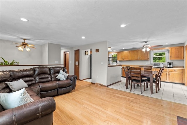 46 Lisa Ln, Methuen, MA 01844 - living room featuring ceiling fan, recessed lighting, and light wood-style flooring