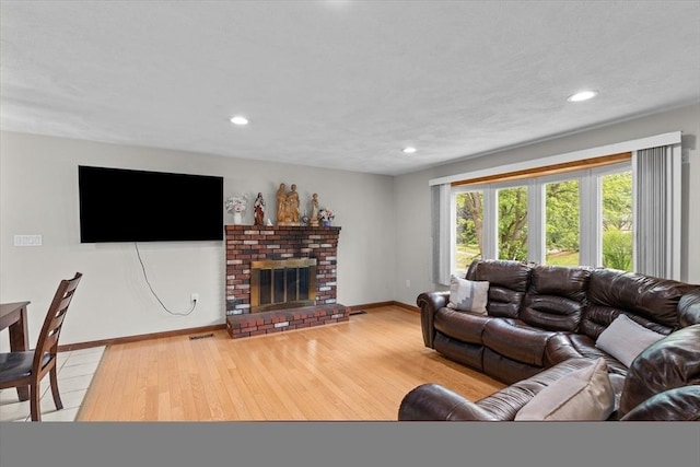 46 Lisa Ln, Methuen, MA 01844 - living area featuring hardwood / wood-style floors, a brick fireplace, and recessed lighting