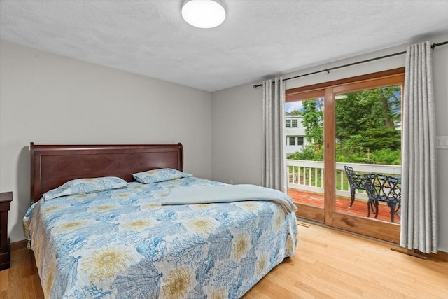 46 Lisa Ln, Methuen, MA 01844 - bedroom featuring light wood-style flooring, access to outside, and a textured ceiling