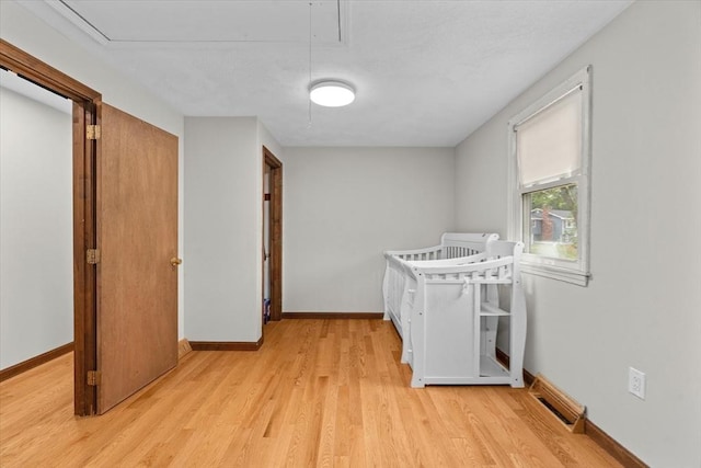 46 Lisa Ln, Methuen, MA 01844 - bedroom featuring attic access and light wood-style flooring