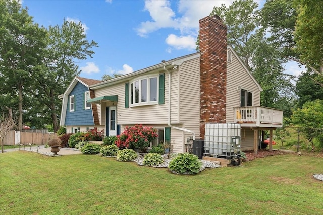 46 Lisa Ln, Methuen, MA 01844 - view of side of property featuring a chimney and a wooden deck