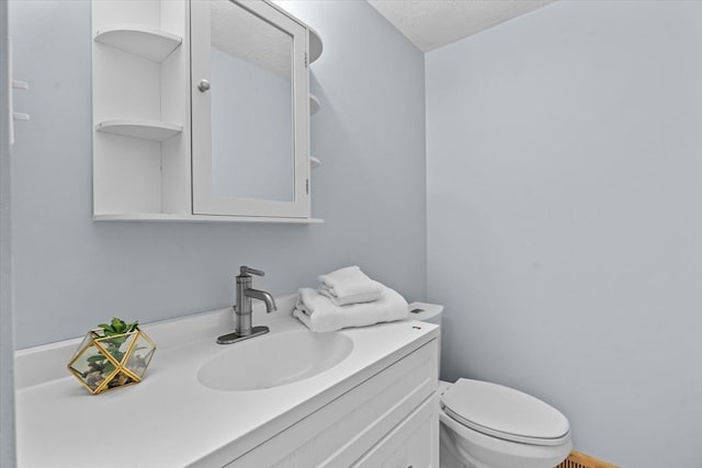 46 Lisa Ln, Methuen, MA 01844 - half bathroom featuring vanity and a textured ceiling