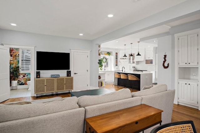 38 Thatcher St, Medford, MA 02155 - living room with light wood-type flooring and recessed lighting