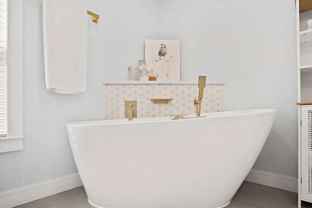38 Thatcher St, Medford, MA 02155 - bathroom view of a freestanding tub and baseboards