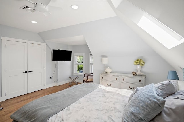 38 Thatcher St, Medford, MA 02155 - bedroom featuring a skylight, vaulted ceiling, wood finished floors, recessed lighting, and ceiling fan