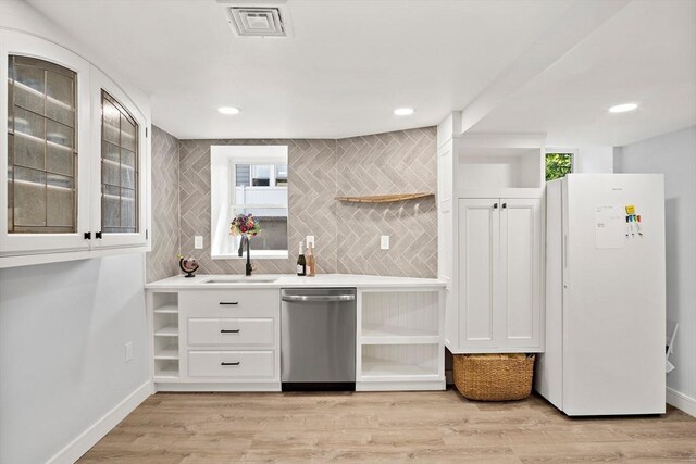 38 Thatcher St, Medford, MA 02155 - indoor wet bar featuring stainless steel dishwasher, freestanding refrigerator, backsplash, light wood-style flooring, and recessed lighting