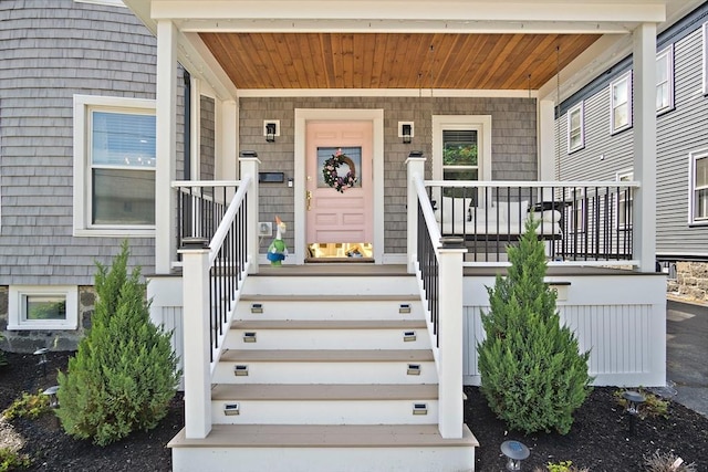 38 Thatcher St, Medford, MA 02155 - doorway to property featuring covered porch