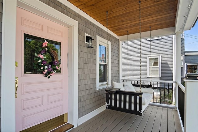 38 Thatcher St, Medford, MA 02155 - wooden deck featuring covered porch