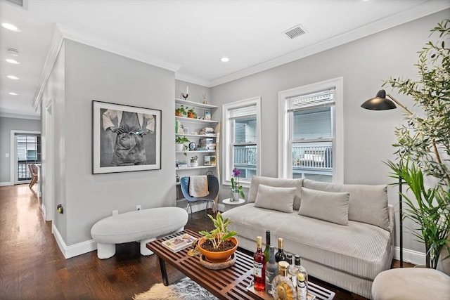 living area featuring visible vents, recessed lighting, dark wood finished floors, crown molding, and baseboards
