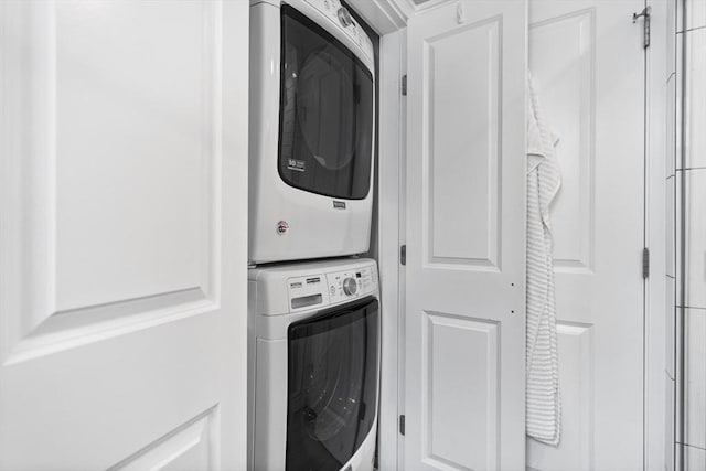 laundry area with laundry area and stacked washing maching and dryer