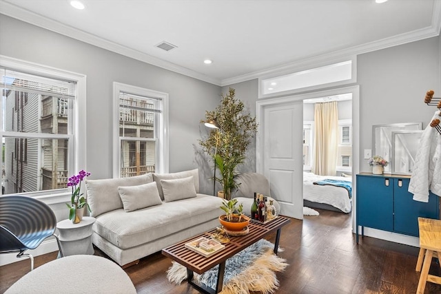 living room with crown molding, visible vents, wood finished floors, and recessed lighting