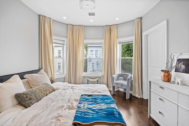 bedroom featuring visible vents, dark wood-type flooring, and recessed lighting