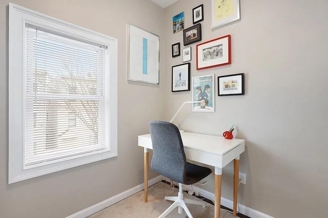 office space with baseboards and carpet floors