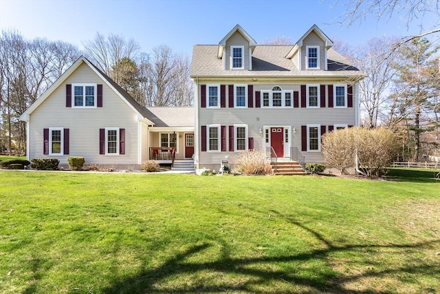 colonial home featuring a front yard