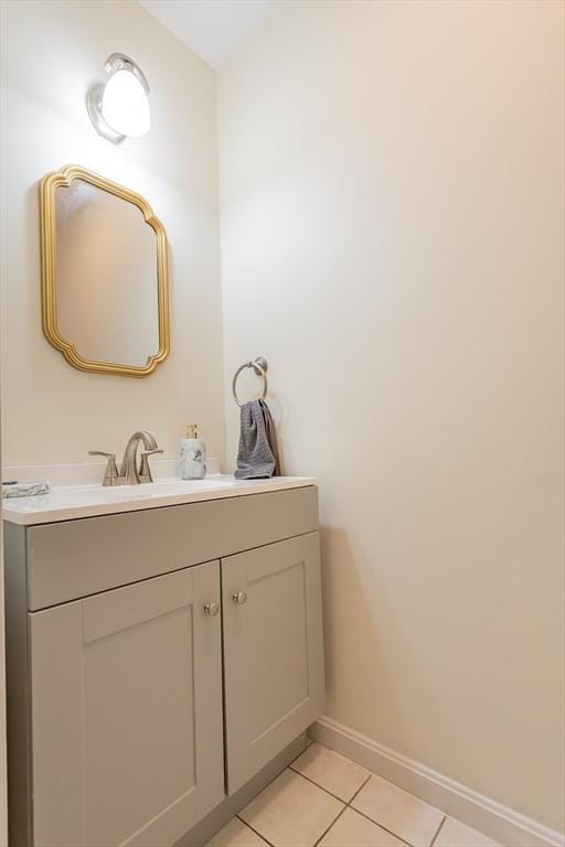 bathroom featuring vanity, tile patterned floors, and baseboards