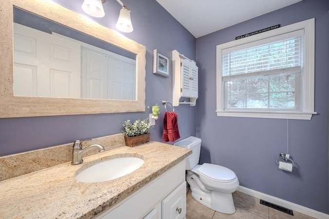 36 Westford Rd, Ayer, MA 01432 - bathroom featuring vanity, toilet, tile patterned flooring, and baseboards
