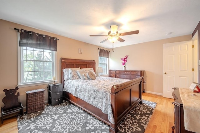 36 Westford Rd, Ayer, MA 01432 - bedroom with light wood-type flooring, a ceiling fan, and baseboards
